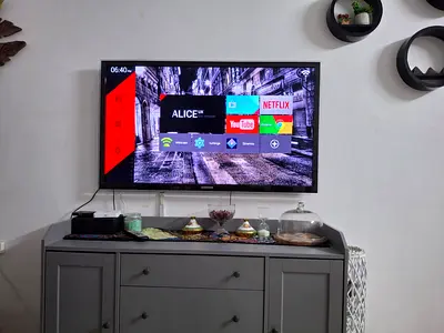 Samsung 55 LED TV mounted with remote and streaming apps