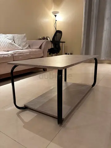Modern two-tier coffee table with metal frame and marble-look tops