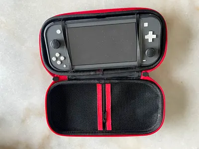 Nintendo Switch Lite (Gray) with protective travel case