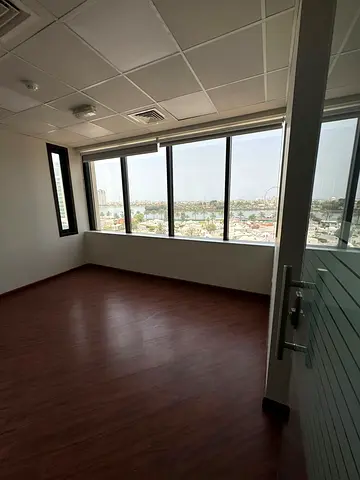 Office space for annual rent in Al Majaz 1 area with free AC. Exclusive offer: 6 months free with AC provided by the owner. Area: 1445 sq m