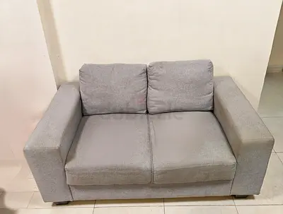Two piece (2) Two-seater grey fabric sofa - good condition