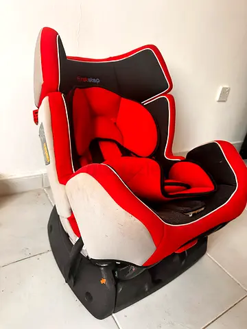 Red and black infant car seat with base — used, good condition