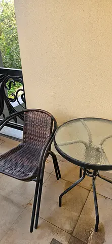 Outdoor set - glass top table with two woven chairs