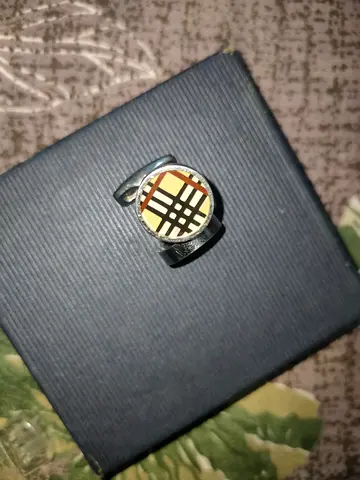 Pair of mens designer-style cufflinks with check pattern