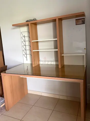 Large wooden study desk with shelving and glass top