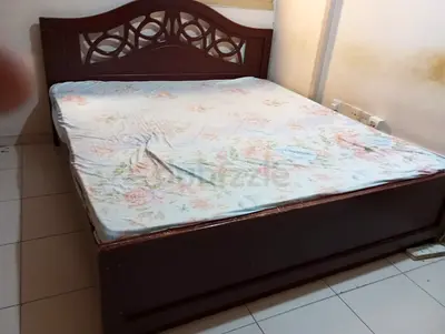 Sturdy Wooden King Size Bed with Decorative Headboard