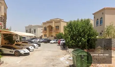 Residential land for sale in Al Yasmeen, Ajman, located on a corner plot with two sides (street & alley), offering excellent accessibility and ideal f