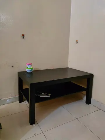 Simple black coffee table with lower shelf - good condition