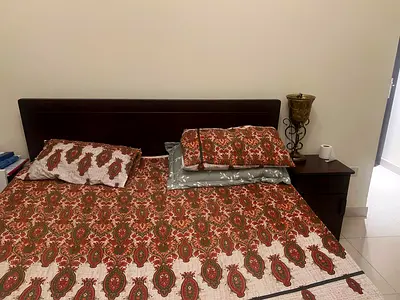 King wooden bed frame with headboard and bedside table