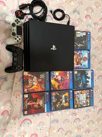 PlayStation 4 Pro console with 2 controllers + 8 PS4 games