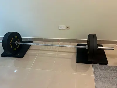 Standard Olympic Barbell with Weight Plates - Good Condition, and Weight rack.2x 10,15,20,25kg plate