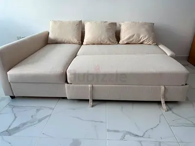 Beige L-shaped Sofa Bed with Storage - Good Condition