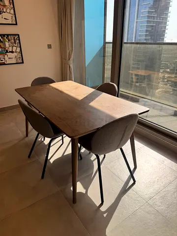 Solid wood dining table with 4 modern fabric chairs never used new dining table