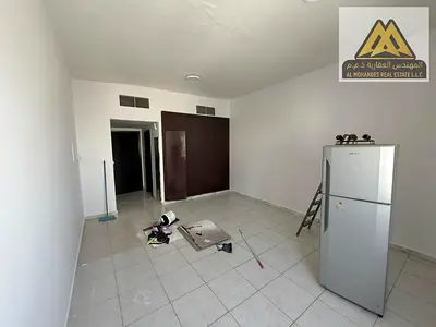 Annual spacious studio for rent in Al Rashidiya 3, Ajman. Semi-separate kitchen, central AC, built-