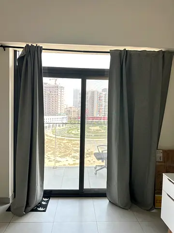 Set of two curtains with rods and two extra rods. One is ikea and unused still in original packing