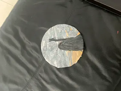 Hand-painted round slate artwork — bird silhouette on natural stone