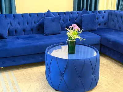Blue Velvet L-Shaped Sectional Sofa with Matching Round Ottoman