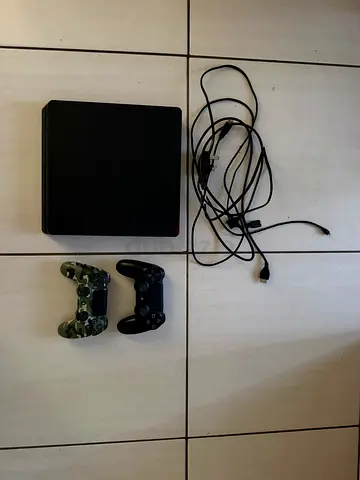PS4 Slim with 2 DualShock Controllers and cables, 15 Games - Excellent Condition