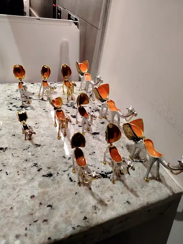 Set of decorative camel figurines with amber-colored inlay (collection)