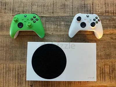 Xbox Series S console with two wireless controllers (green  white)