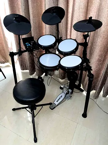 Alesis Nitro Max electronic drum kit with mesh pads, pedals and stool