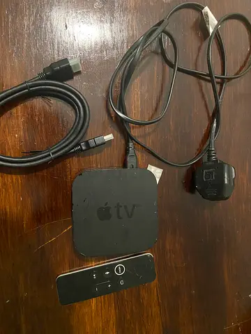 Apple TV (3rd/4th gen) with Siri Remote and HDMI cable - used has cracks but still works fast