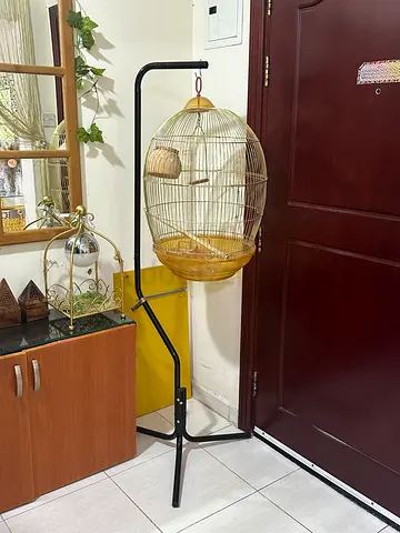 Gold bird cage with stand and accessories - used, good condition