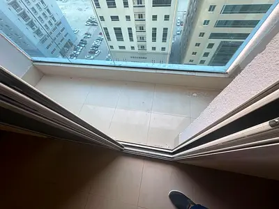 Spacious 3-bedroom apartment with a living room for annual rent in Al Taawun | Maid's room, large hallway, and central air conditioning