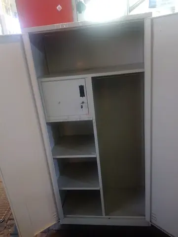 White metal wardrobe / storage cabinet with shelves and lock