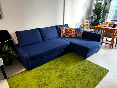 Blue L-shaped Sofa Bed with Storage - Good Condition