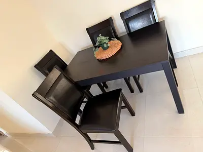 Dark Wood 4-Seater Dining Table with Upholstered Chairs - Good Condition