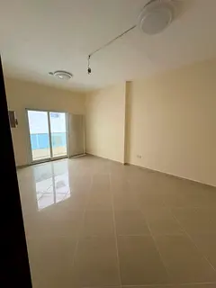 Spacious 2BR + Hall: Prime Location Near Al Qasba Canal, Balcony & Excellent Value