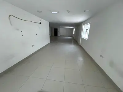 A very large, open-plan apartment suitable for both residential and commercial use. It includes a kitchen, bathroom, and central air conditioning. It