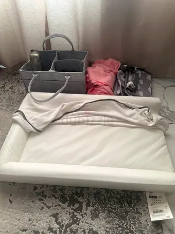 Ikea Baby Changing Pad with Removable Cover, Pink wrap carrier, Grey basket and more