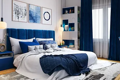Blue upholstered bed with built-in shelving and matching curtains