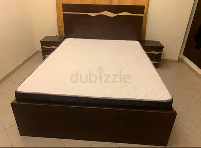 Bed with mattress and side tables