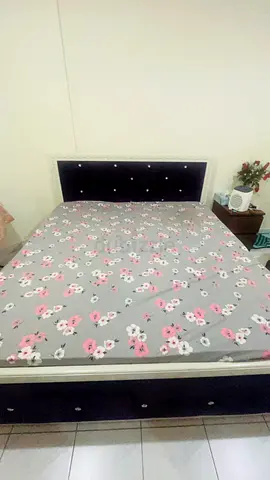 Double king bed with upholstered headboard and storage base - good condition
