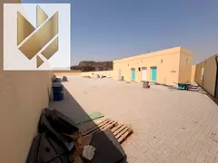 A walled plot of land in Al Sajaa, in one of the best areas, easy access, 35kW electricity.