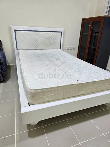 White Bed Frame with Mattress and Padded Headboard