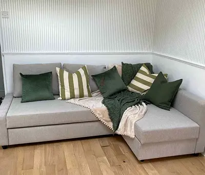 Light grey L-shaped sofa with chaise, good condition