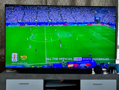 Samsung 65 inch QLED Smart TV in excellent condition (works perfectly)