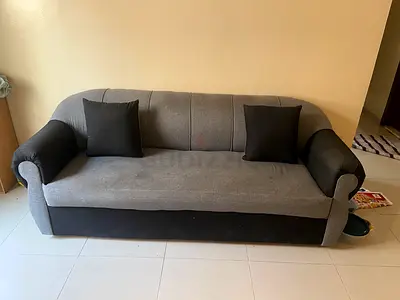 3-Seater Grey Fabric Sofa with Two Cushions - Good Condition