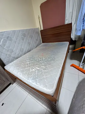Double wooden bed frame with mattress - used