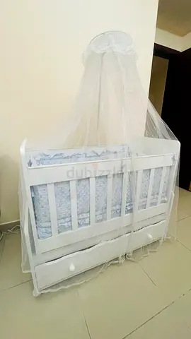 White wooden baby crib with drawer and canopy - good condition