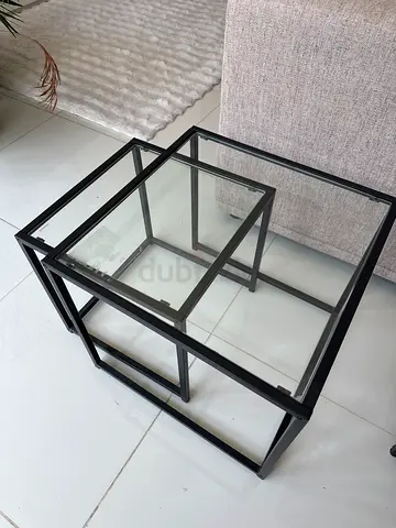 Set of 2 Glass end tables, diff sizes.