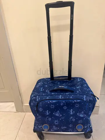 Blue patterned small trolley backpack with extendable handle and wheels