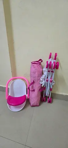 4 in 1 Doll Nursrey Playset with stroller and Crib pink, gently used (40 AED)