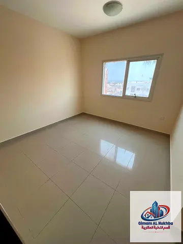 **Annual Rental – Al Bu Tina, Sharjah** **Spacious 2-bedroom apartment with an open view, large and comfortable layout, central air conditioning and