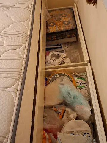 Storage coat with mattress