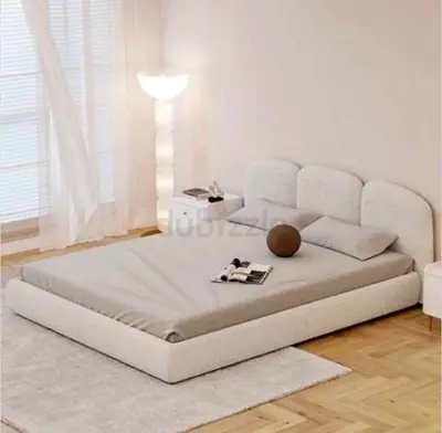 Low-profile upholstered double bed frame with padded headboard - beige